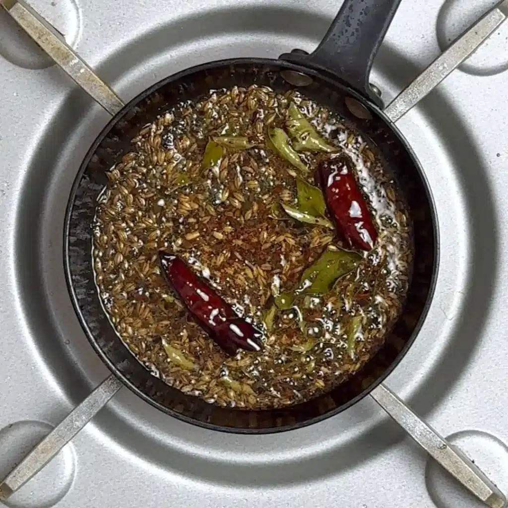 for tempering, heat pan, add oil and dry ingredients,