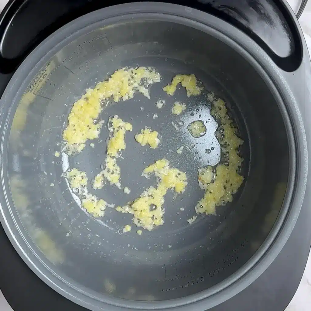 set cooker on saute mode , add ginger garlic