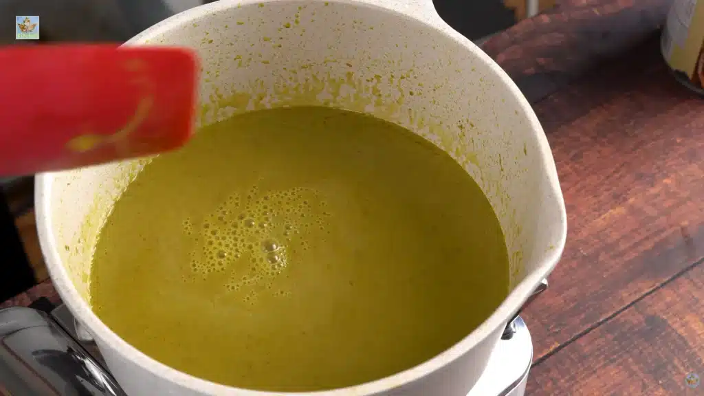 Pour the coconut milk and hot water straight into the pot. Mix it all together and add a pinch more salt. Let the liquid boil, then lower the heat and let it simmer for 7 to 10 minutes.