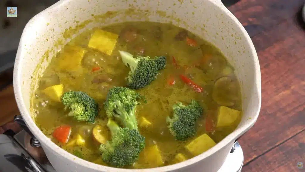 Toss in the broccoli and snap peas. Cook them for exactly 2 minutes so they stay crunchy. Turn off the stove, squeeze the fresh lime juice over the top, and serve it hot with rice.