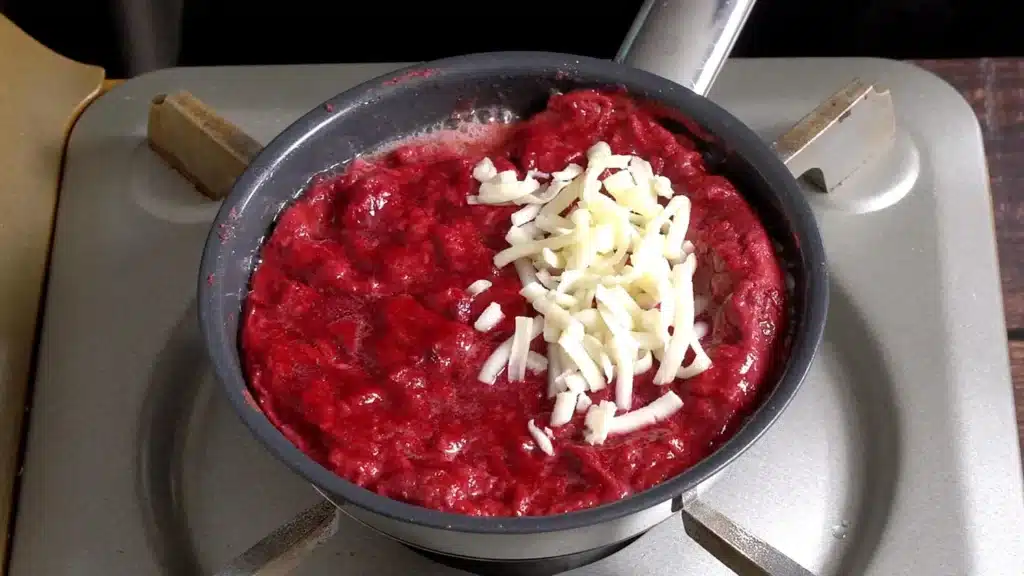 Colourful Beetroot Bloody Omelette with Melted Cheese add cheese and fold in half