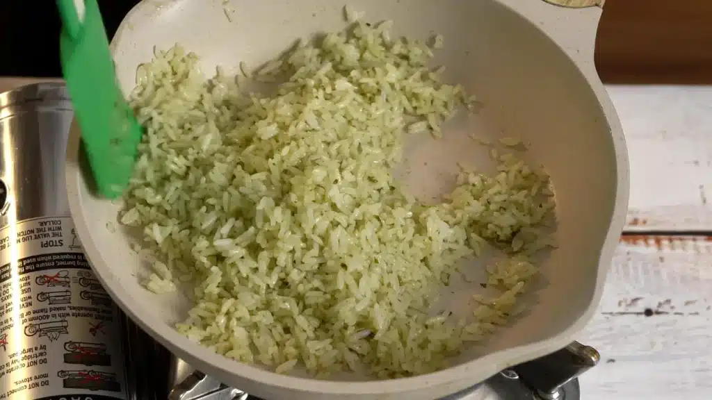 cooked rice and pesto , mix well