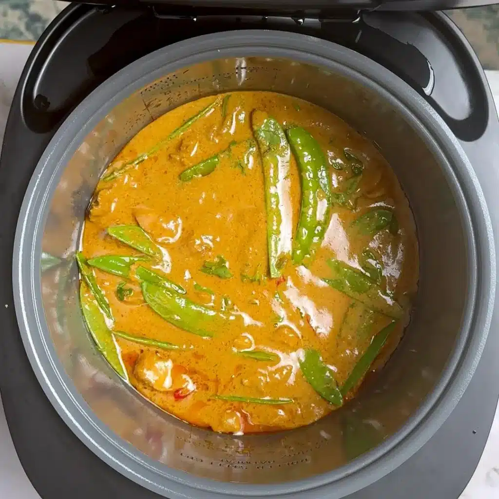 Easy & Creamy Crockpot Thai Chicken Curry cover and cook, add snow peas, chopped chilli, coriander leaves