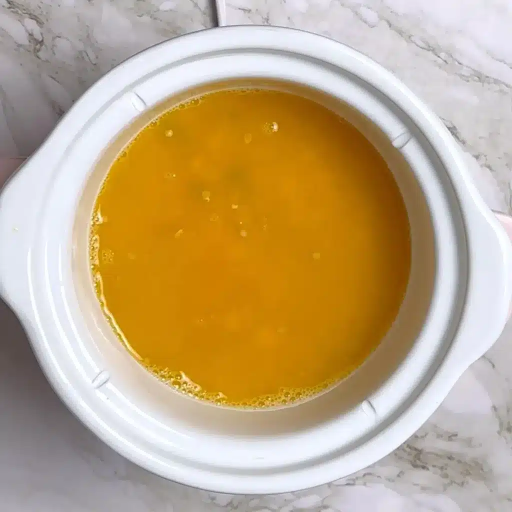 Easy Slow Cooker Creamy Lentils Recipe in a cooker, add soaked lentils, ginger chilli salt termeric water