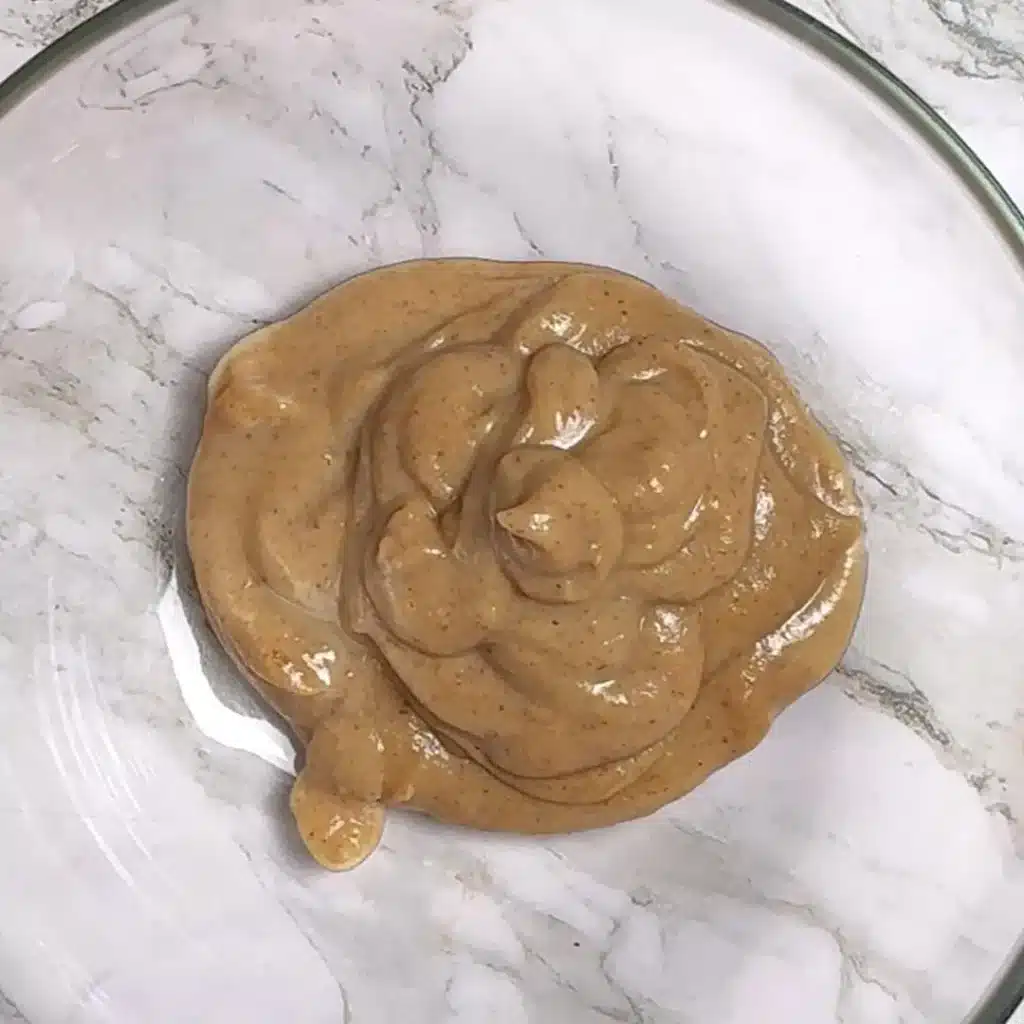 Simple Eggless Walnut Cake for Tea Time in a pan add dates and milk , make a smooth paste
