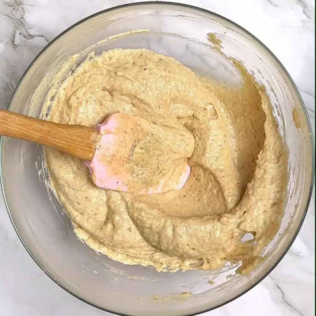 Simple Eggless Walnut Cake for Tea Time now add butter and oil , then all the dry ingredients , mix well