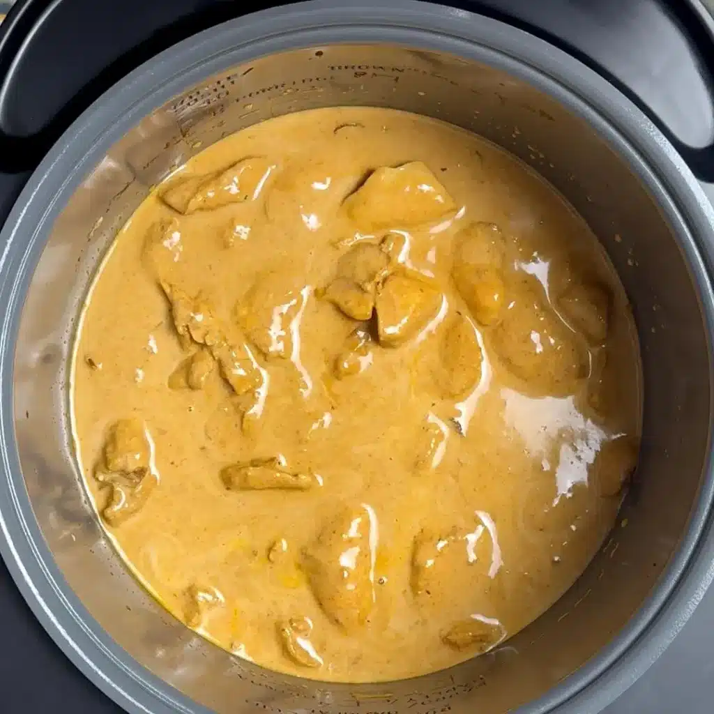 Easy & Creamy Crockpot Thai Chicken Curry now add chicken , coconut milk , mix well