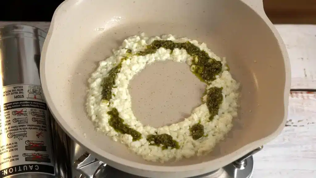 place feta cheese, add pesto on top