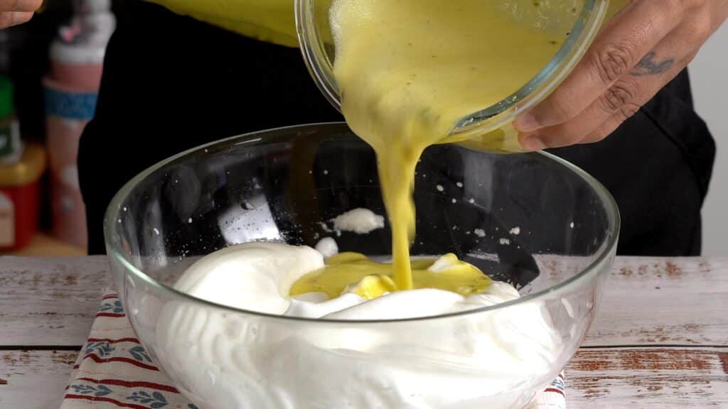 wisk egg yolk , add ingredients, mix with egg whites mixture
