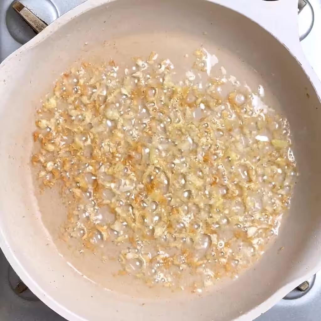 Try This Creamy, Tangy and Spicy Soya Chukauni heat oil in pan, add crushed garlic, saute until golden