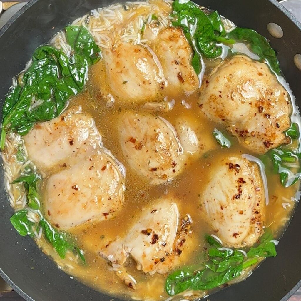 One Pan Spinach & Chicken Rice (Greek Inspired) now add chicken stock , spinach then chicken thighs