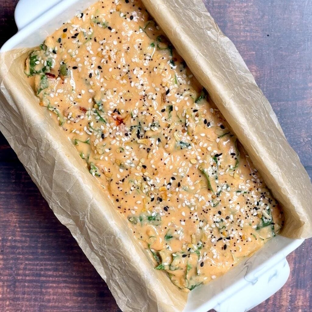 Flourless Lentil Bread with Spinach & Seeds — No Yeast, No Flour pour batter into bread pan