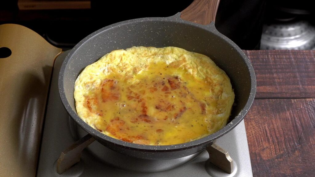 Easy Potato Omelette with Onions, Mushrooms and Cheese pour egg mixture