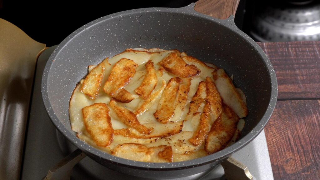 Easy Potato Omelette with Onions, Mushrooms and Cheese sprinkle salt and pepper, once bottom set flip other side
