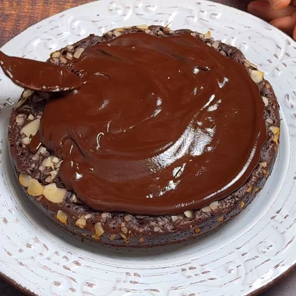 Break the chocolate into pieces then add little butter and milk or cream. Melt it in the microwave or over water bath until smooth and runny.