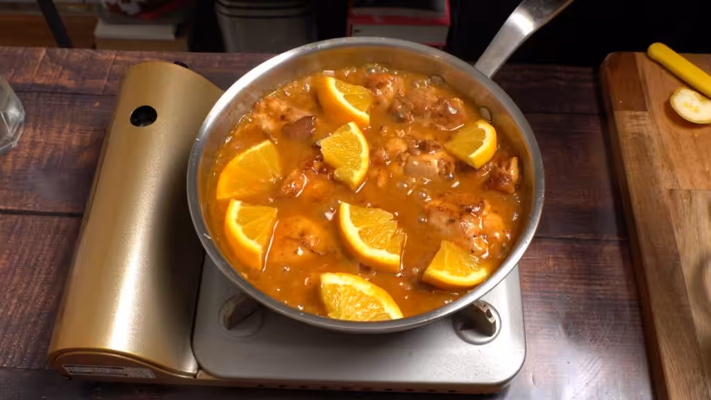 Simple Yet Impressive Orange Glazed Chicken add slury, chicken and orange pieces