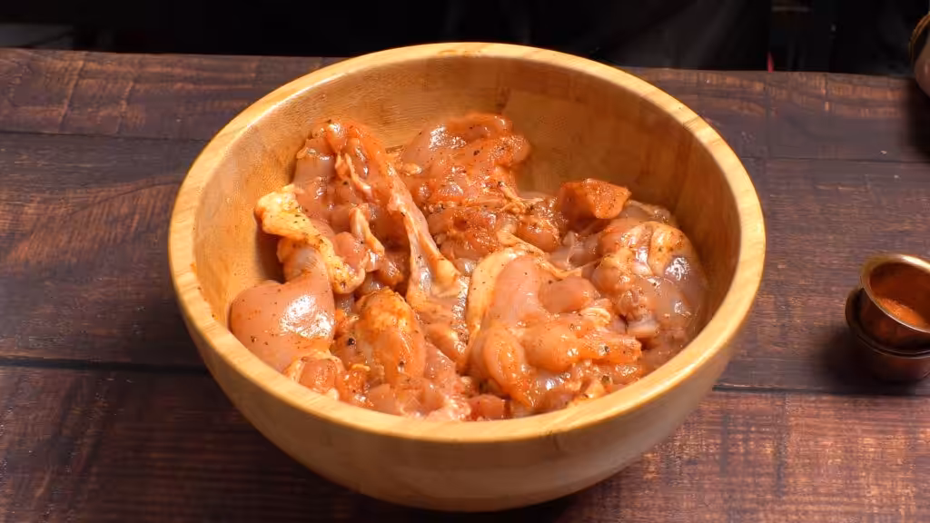Simple Yet Impressive Orange Glazed Chicken marinate chicken in a bowl with spices