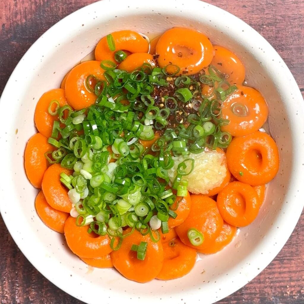 place cooked noodles in a bowl, add remaining ingredients, and mix it
