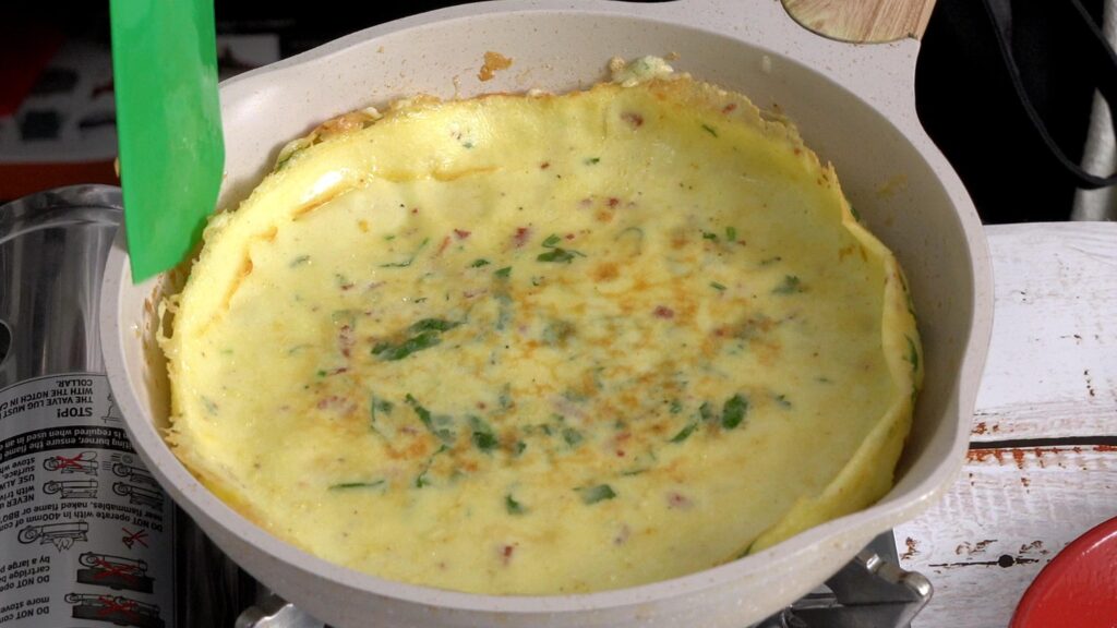 pour egg , cook and flip it