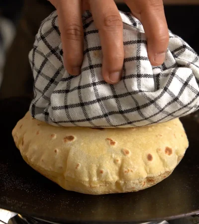 Whole wheat Indian flatbread (roti) puffed and golden